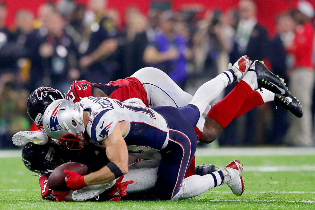 HOUSTON, TX - FEBRUARY 05: Julian Edelman #11 of the New England Patriots makes a 23 yard catch in the fourth quarter against Ricardo Allen #37 and Keanu Neal #22 of the Atlanta Falcons during Super Bowl 51 at NRG Stadium on February 5, 2017 in Houston, Texas.