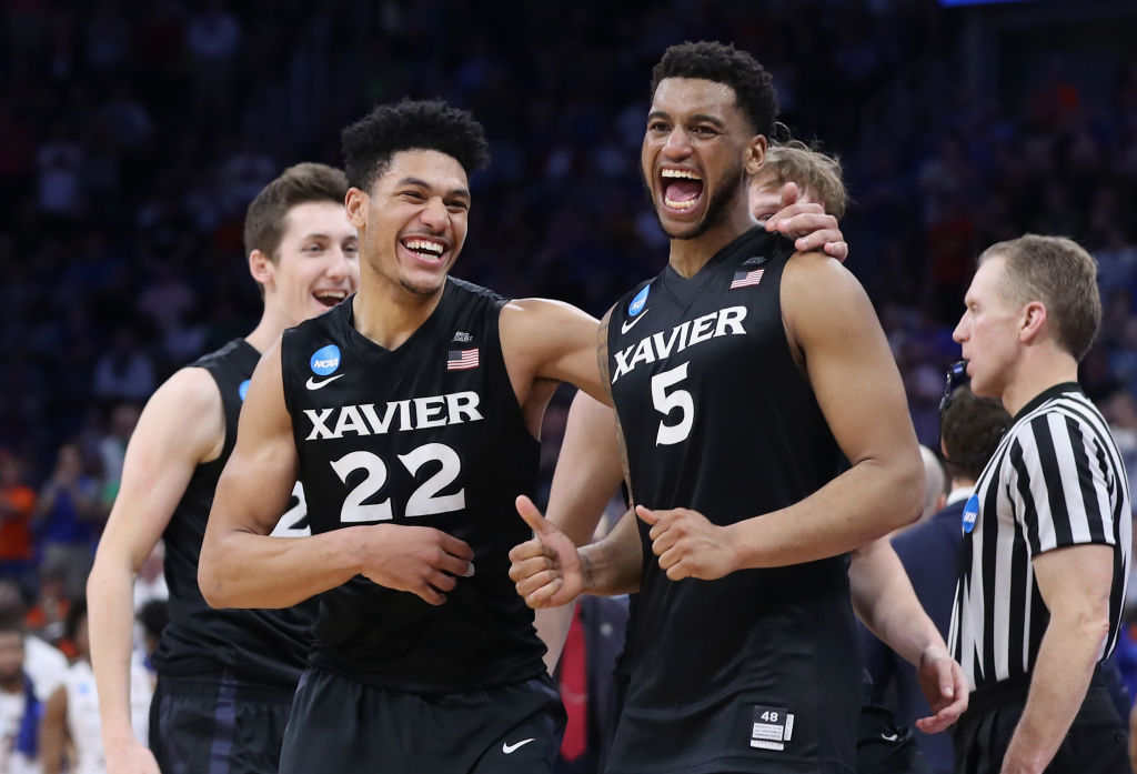 ORLANDO, FL - MARCH 18: Kaiser Gates #22 and Trevon Bluiett #5 of the Xavier Musketeers celebrate their 91-66 over the Florida State Seminoles to advance during the second round of the 2017 NCAA Men's Basketball Tournament at the Amway Center on March 18, 2017 in Orlando, Florida