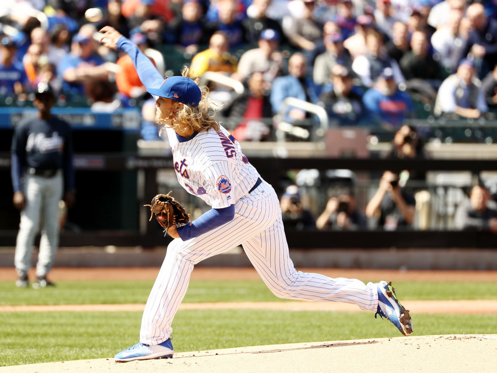 NEW YORK, NY - APRIL 03: Noah Syndergaard #34 of the New York Mets delivers a pitch in the first inning against the Atlanta Braves during Opening Day on April 3, 2017 at Citi Field in the Flushing neighborhood of the Queens borough of New York City.