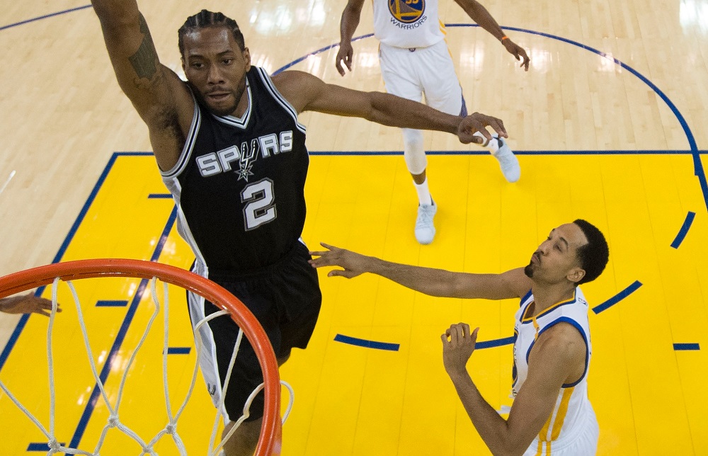 OAKLAND, CA - MAY 14: Kawhi Leonard #2 of the San Antonio Spurs goes up for a shot against the Golden State Warriors during Game One of the NBA Western Conference Finals at ORACLE Arena on May 14, 2017 in Oakland, California