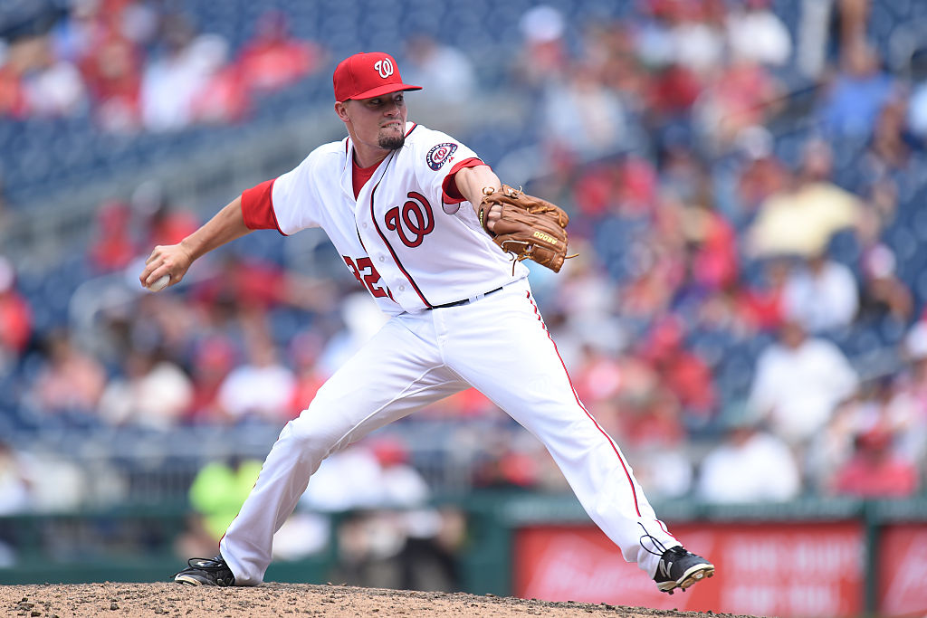 WASHINGTON, DC - JULY 21:  Koda Glover #34 of the Washington Nationals pitches in the ninth inning during a baseball game against the Los Angeles Dodgers at Nationals Park on July 21, 2016 in Washington, DC. 
