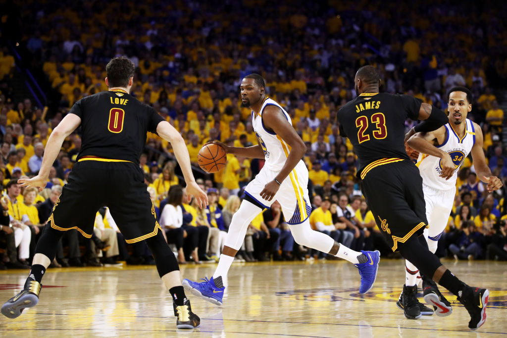 OAKLAND, CA - JUNE 04: Kevin Durant #35 of the Golden State Warriors is defended by Kevin Love #0 and LeBron James #23 of the Cleveland Cavaliers during the second half of Game 2 of the 2017 NBA Finals at ORACLE Arena on June 4, 2017 in Oakland, California