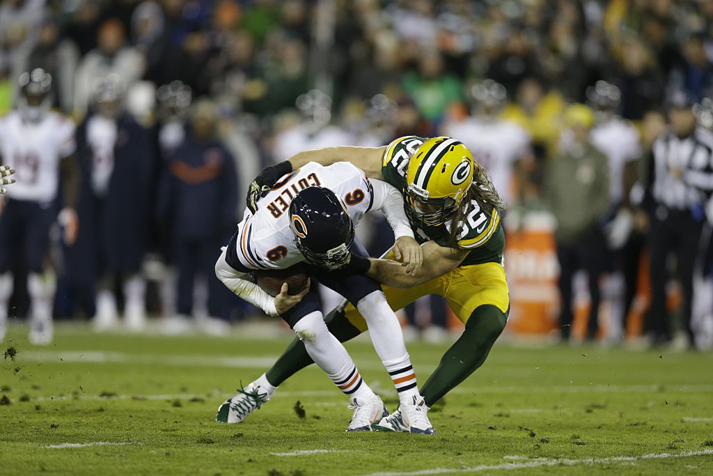 GREEN BAY, WI - NOVEMBER 9:  Clay Matthews #52 of the Green Bay Packers sacks Jay Cutler #6 of the Chicago Bears at Lambeau Field on November 9, 2014 in Green Bay, Wisconsin.  The Packers defeated the Bears 55-14. 