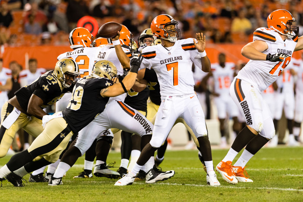 CLEVELAND, OH - AUGUST 10: Quarterback DeShone Kizer #7 of the Cleveland Browns passes while under pressure from linebacker Adam Bighill #99 of the New Orleans Saints during the second half of a preseason game at FirstEnergy Stadium on August 10, 2017 in Cleveland, Ohio. The Browns defeated the Saints 20-14.