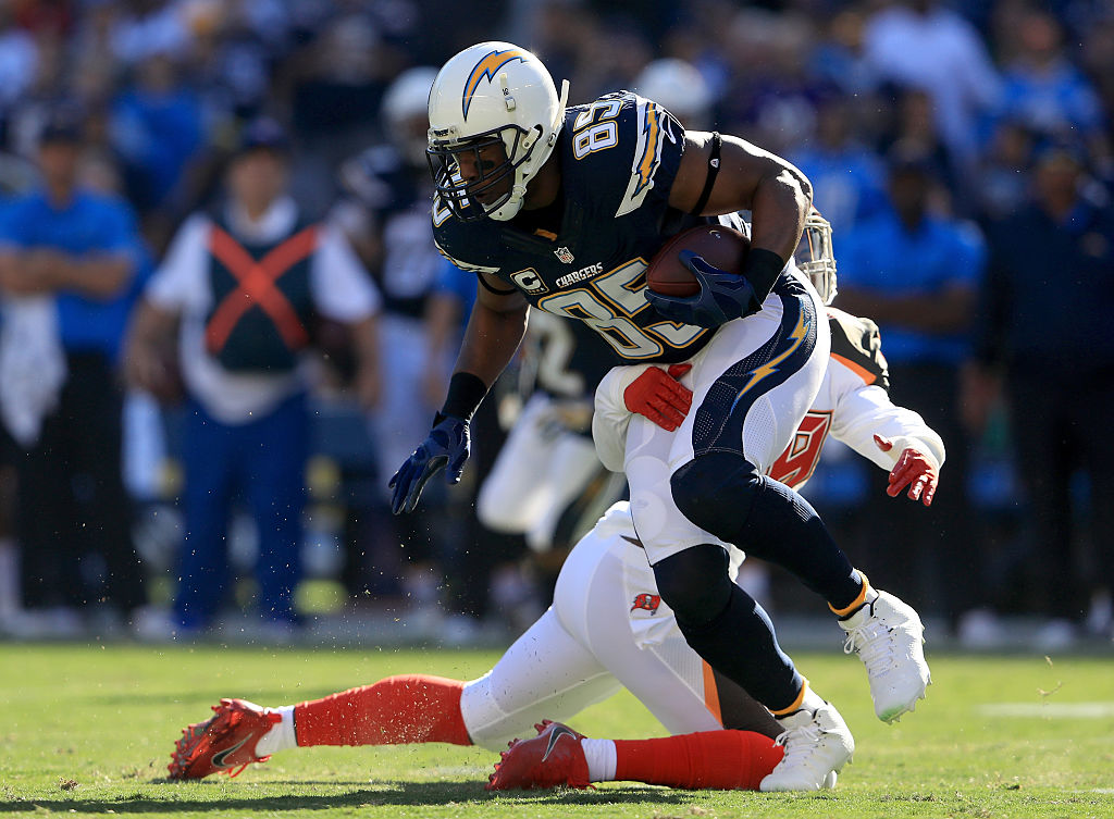 Antonio Gates #85 of the San Diego Chargers is pulled down by Kwon Alexander #58 of the Tampa Bay Buccaneers during the first half at Qualcomm Stadium on December 4, 2016 in San Diego, California.