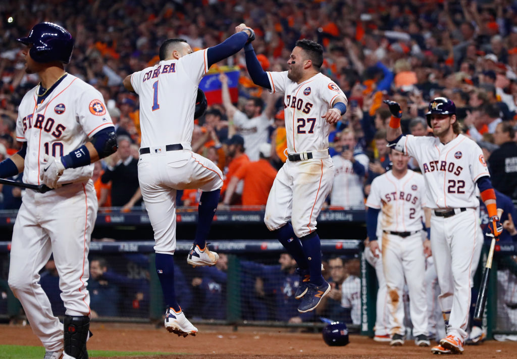 HOUSTON, TX - OCTOBER 29: Carlos Correa #1 of the Houston Astros celebrates with Jose Altuve #27 after hitting a two-run home run during the seventh inning against the Los Angeles Dodgers in game five of the 2017 World Series at Minute Maid Park on October 29, 2017 in Houston, Texas.