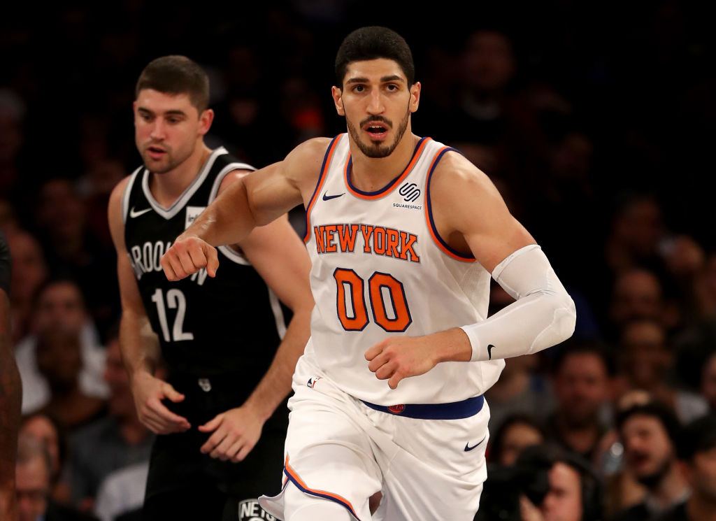 NEW YORK, NY - OCTOBER 27: Enes Kanter #00 of the New York Knicks celebrates his basket in the second half as Joe Harris #12 of the Brooklyn Nets looks on at Madison Square Garden on October 27, 2017 in New York City