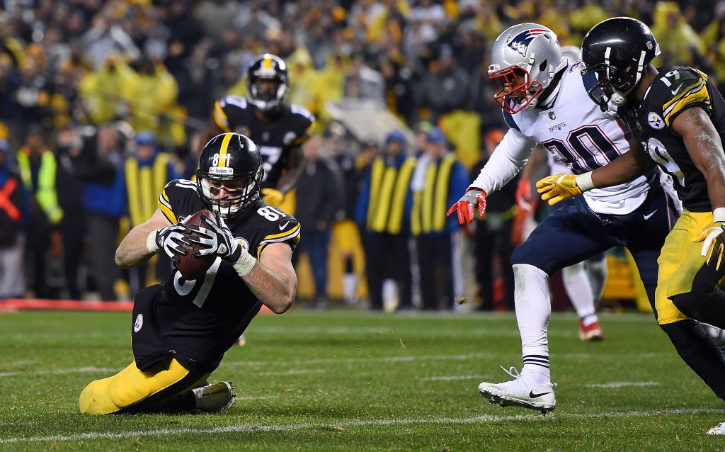 PITTSBURGH, PA - DECEMBER 17: Jesse James #81 of the Pittsburgh Steelers dives for the end zone for an apparent touchdown in the fourth quarter during the game against the New England Patriots at Heinz Field on December 17, 2017 in Pittsburgh, Pennsylvania. After official review, it was ruled an incomplete pass