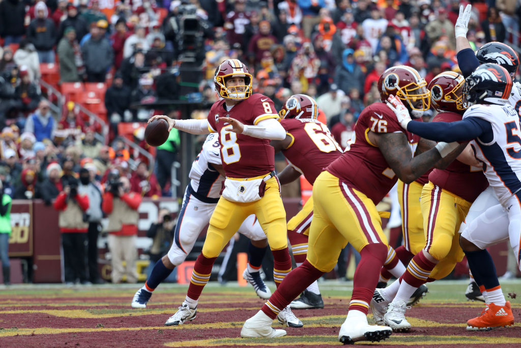 LANDOVER, MD - DECEMBER 24: Quarterback Kirk Cousins #8 of the Washington Redskins throws a first half pass against the Denver Broncos in the first quarter at FedExField on December 24, 2017 in Landover, Maryland.