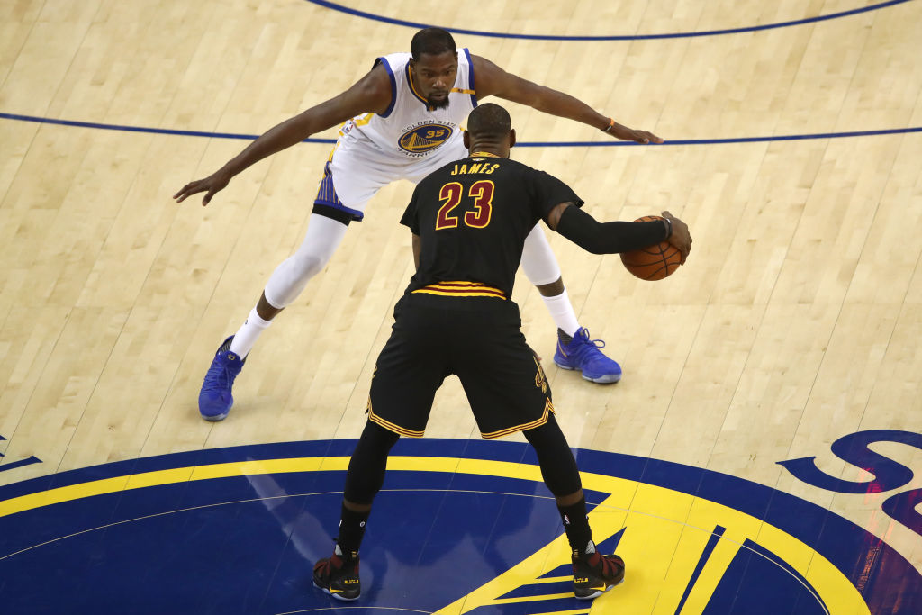 OAKLAND, CA - JUNE 12: LeBron James #23 of the Cleveland Cavaliers is defended by Kevin Durant #35 of the Golden State Warriors during the first half in Game 5 of the 2017 NBA Finals at ORACLE Arena on June 12, 2017 in Oakland, California