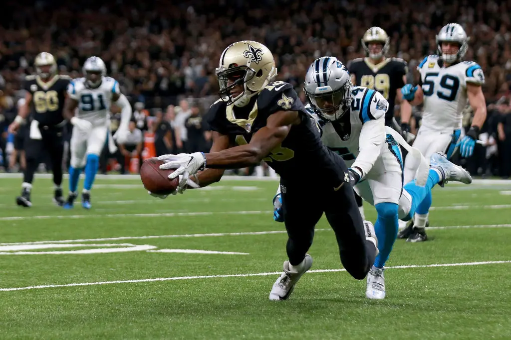 Michael Thomas of the New Orleans Saints catches a pass over James Bradberry #24 of the Carolina Panthers during the first half of the NFC Wild Card playoff game at the Mercedes-Benz Superdome on January 7, 2018 in New Orleans, Louisiana. 