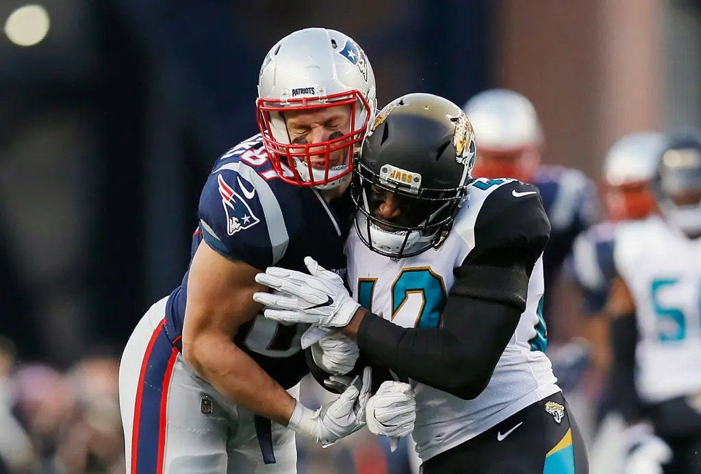 FOXBOROUGH, MA - JANUARY 21: Rob Gronkowski #87 of the New England Patriots is hit by Barry Church #42 of the Jacksonville Jaguars in the second quarter during the AFC Championship Game at Gillette Stadium on January 21, 2018 in Foxborough, Massachusetts.