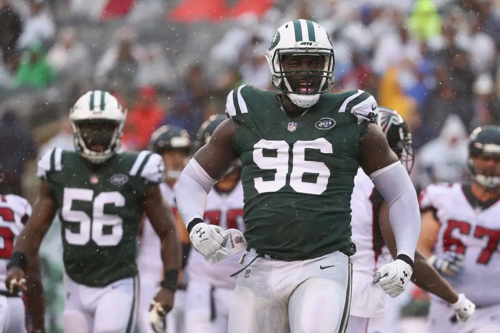 EAST RUTHERFORD, NJ - OCTOBER 29: Defensive end Muhammad Wilkerson #96 of the New York Jets celebrates a tackle against running back Tevin Coleman #26 (not pictured) of the Atlanta Falcons during the third quarter of the game at MetLife Stadium on October 29, 2017 in East Rutherford, New Jersey.