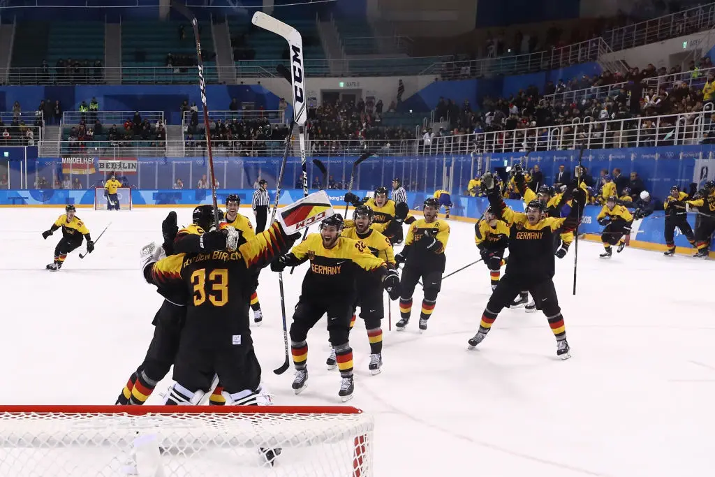 GANGNEUNG, SOUTH KOREA - FEBRUARY 21: Team Germany celebrates after defeating Sweden 4-3 in overtime during the Men's Play-offs Quarterfinals game on day twelve of the PyeongChang 2018 Winter Olympic Games at Kwandong Hockey Centre on February 21, 2018 in Gangneung, South Korea.