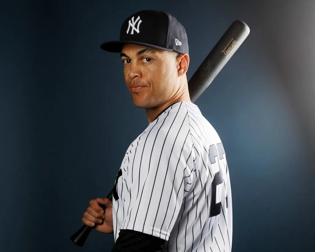 TAMPA, FL - FEBRUARY 21: Giancarlo Stanton #27 of the New York Yankees poses for a portrait during the New York Yankees photo day on February 21, 2018 at George M. Steinbrenner Field in Tampa, Florida. (Photo by Elsa/Getty Images)