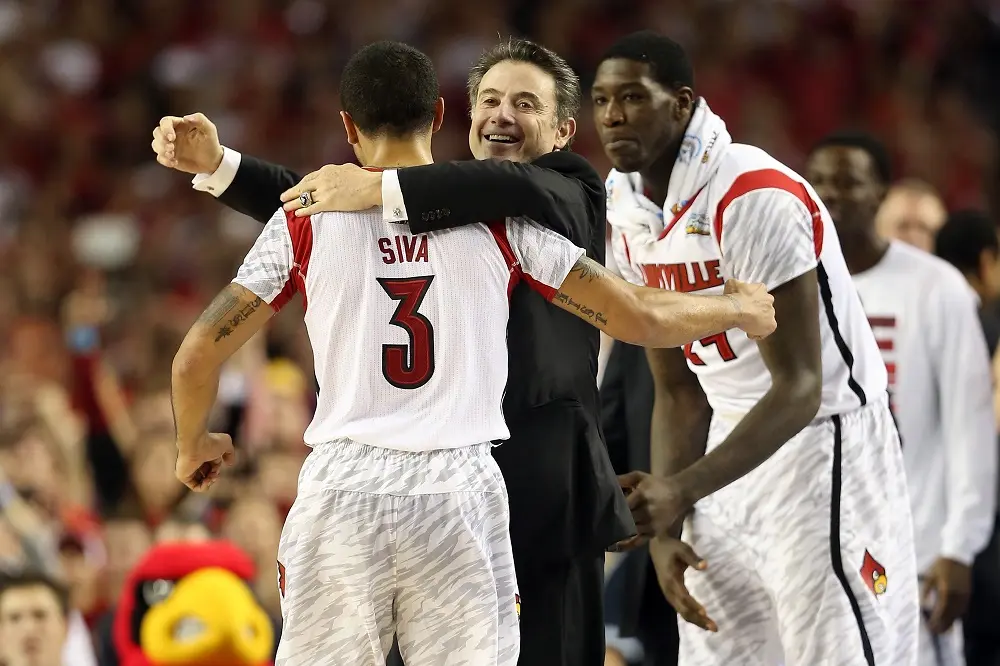 ATLANTA, GA - APRIL 08: (L-R) Peyton Siva #3, head coach Rick Pitino and Montrezl Harrell #24 of the Louisville Cardinals celebrate against the Michigan Wolverines during the 2013 NCAA Men's Final Four Championship at the Georgia Dome on April 8, 2013 in Atlanta, Georgia. 