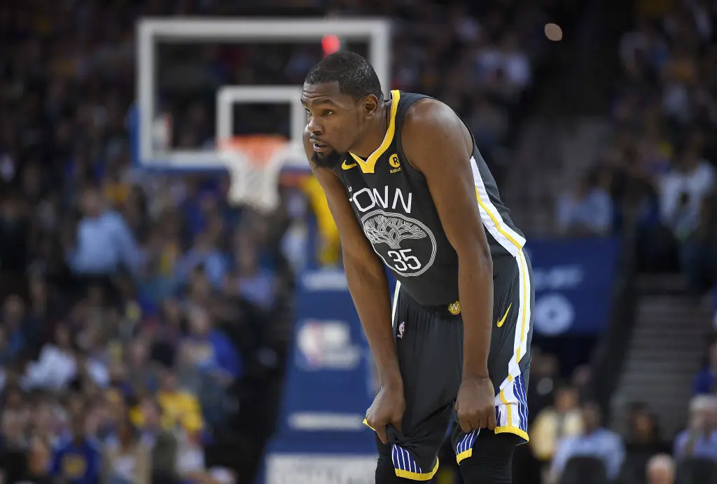OAKLAND, CA - FEBRUARY 06: Kevin Durant #35 of the Golden State Warriors looks on against the Oklahoma City Thunder during their NBA basketball game at ORACLE Arena on February 6, 2018 in Oakland, California