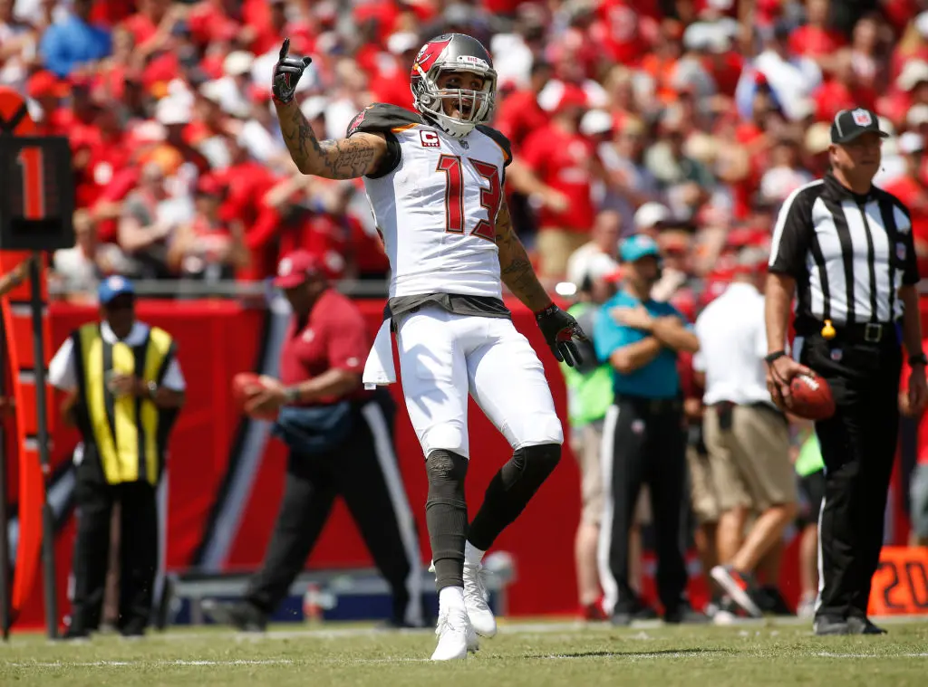 TAMPA, FL - SEPTEMBER 17: Wide receiver Mike Evans #13 of the Tampa Bay Buccaneers celebrates in the end zone after his 13-yard touchdown reception from quarterback Jameis Winston during the first quarter of an NFL football game on September 17, 2017 at Raymond James Stadium in Tampa, Florida.