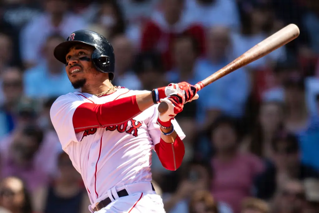 BOSTON, MA - MAY 2: Mookie Betts #50 of the Boston Red Sox hits a solo home run during the fifth inning of a game against the Kansas City Royals on May 2, 2018 at Fenway Park in Boston, Massachusetts. It was his second home run of the game.