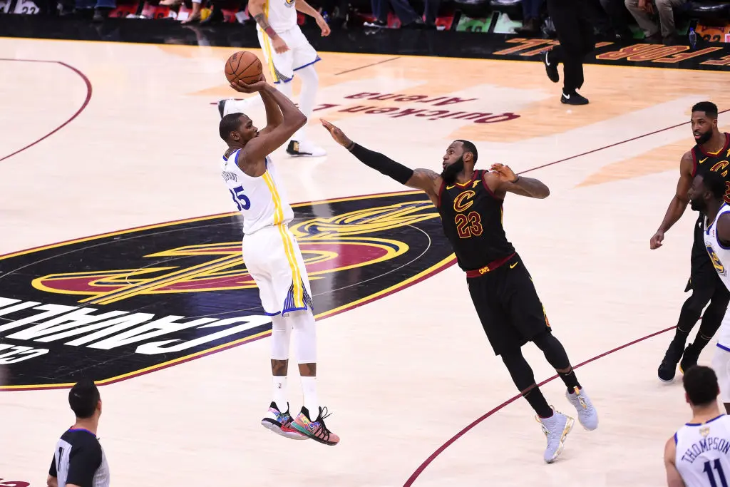 CLEVELAND,OH - June 6: Kevin Durant #35 of the Golden State Warriors shoots the ball over LeBron James #23 of the Cleveland Cavaliers in Game Three of the 2018 NBA Finals on June 6, 2018 at Quicken Loans Arena in Cleveland, Ohio
