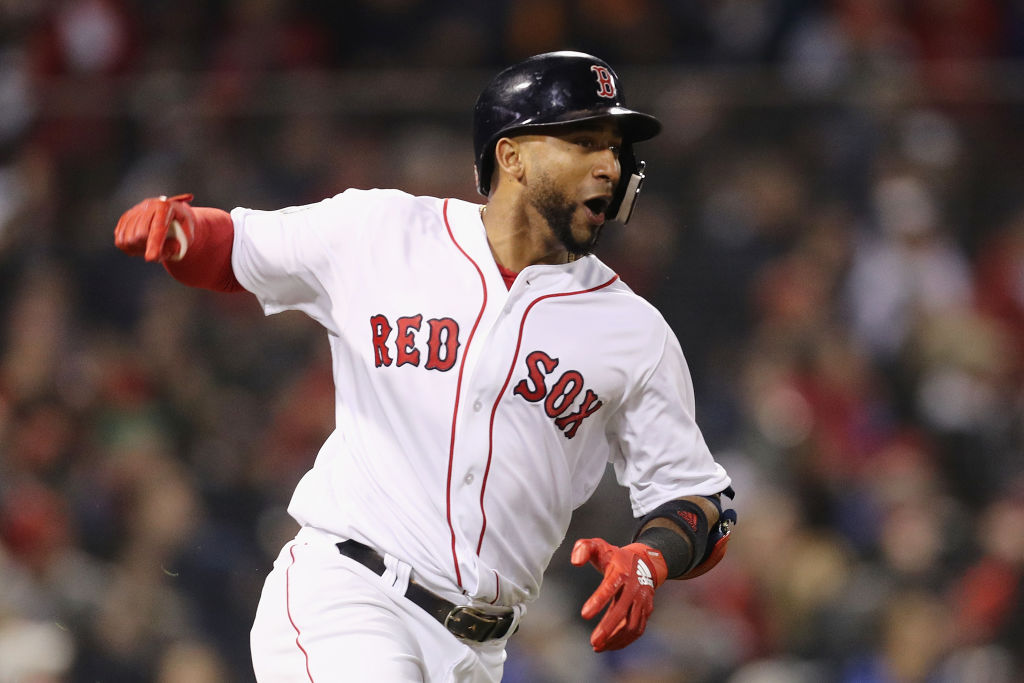 BOSTON, MA - OCTOBER 23: Eduardo Nunez #36 of the Boston Red Sox celebrates his three-run home run during the seventh inning against the Los Angeles Dodgers in Game One of the 2018 World Series at Fenway Park on October 23, 2018 in Boston, Massachusetts.