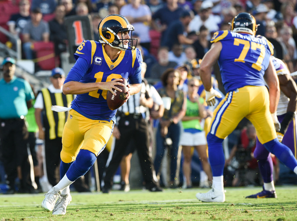LOS ANGELES, CA - SEPTEMBER 27: Quarterback Jared Goff #16 of the Los Angeles Rams rushes out of the pocket against the Minnesota Vikings at Los Angeles Memorial Coliseum on September 27, 2018 in Los Angeles, California