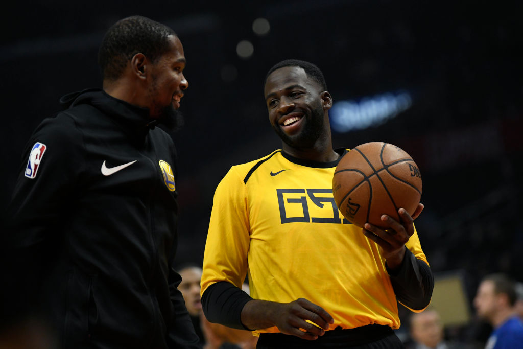 LOS ANGELES, CA - NOVEMBER 12: Kevin Durant #35 of the Golden State Warriors talks to his teamate Draymond Green during warm up before the game against the Los Angeles Clippers on November 12, 2018 at STAPLES Center in Los Angeles, California. NOTE TO USER: User expressly acknowledges and agrees that, by downloading and or using this photograph, User is consenting to the terms and conditions of the Getty Images License Agreement.