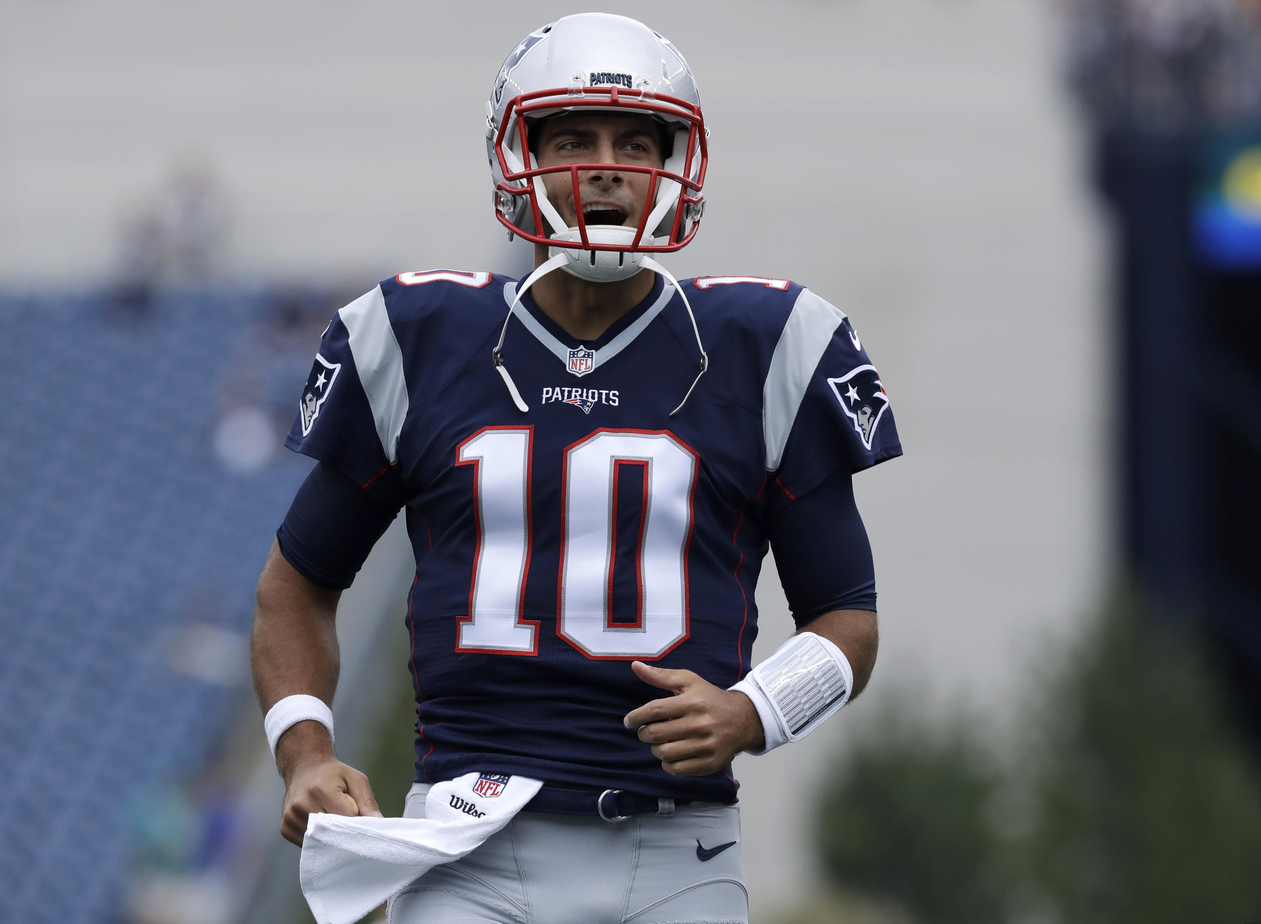 New England Patriots quarterback Jimmy Garoppolo takes the field to warm up before an NFL football game against the Miami Dolphins Sunday, Sept. 18, 2016, in Foxborough, Mass. (AP Photo/Charles Krupa)