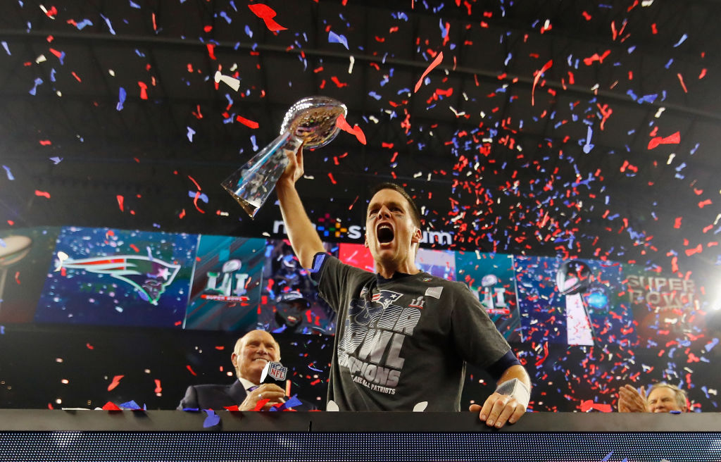 HOUSTON, TX - FEBRUARY 05: Tom Brady #12 of the New England Patriots raises the Vince Lombardi Trophy after defeating the Atlanta Falcons during Super Bowl 51 at NRG Stadium on February 5, 2017 in Houston, Texas. The Patriots defeated the Falcons 34-28.