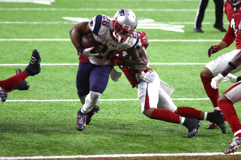 HOUSTON, TX - FEBRUARY 05: James White #28 of the New England Patriots scores the game winning two yard touchdown in overtime against the Atlanta Falcons during Super Bowl 51 at NRG Stadium on February 5, 2017 in Houston, Texas.