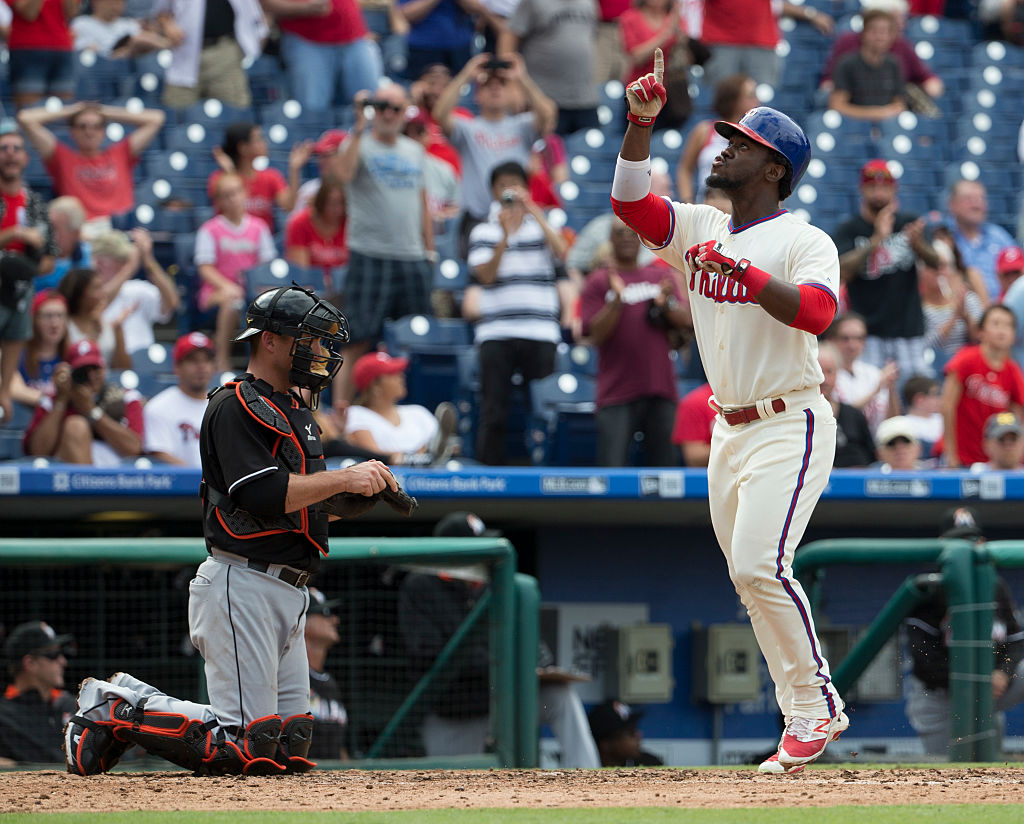PHILADELPHIA, PA - SEPTEMBER 18: Odubel Herrera #37 of the Philadelphia Phillies reacts after hitting a solo home run in the bottom of the third inning in front of Jeff Mathis #6 Miami Marlins at Citizens Bank Park on September 18, 2016 in Philadelphia, Pennsylvania.
