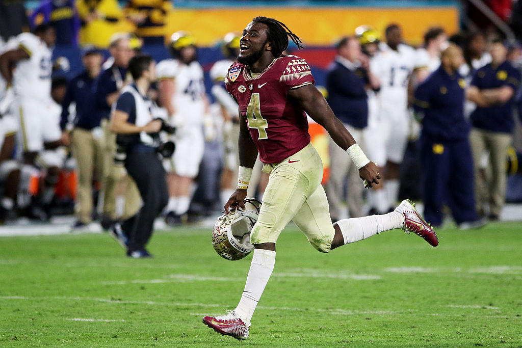 MIAMI GARDENS, FL - DECEMBER 30: MVP Dalvin Cook #4 of the Florida State Seminoles celebrates their 33 to 32 win over the Michigan Wolverines during the Capitol One Orange Bowl at Sun Life Stadium on December 30, 2016 in Miami Gardens, Florida.