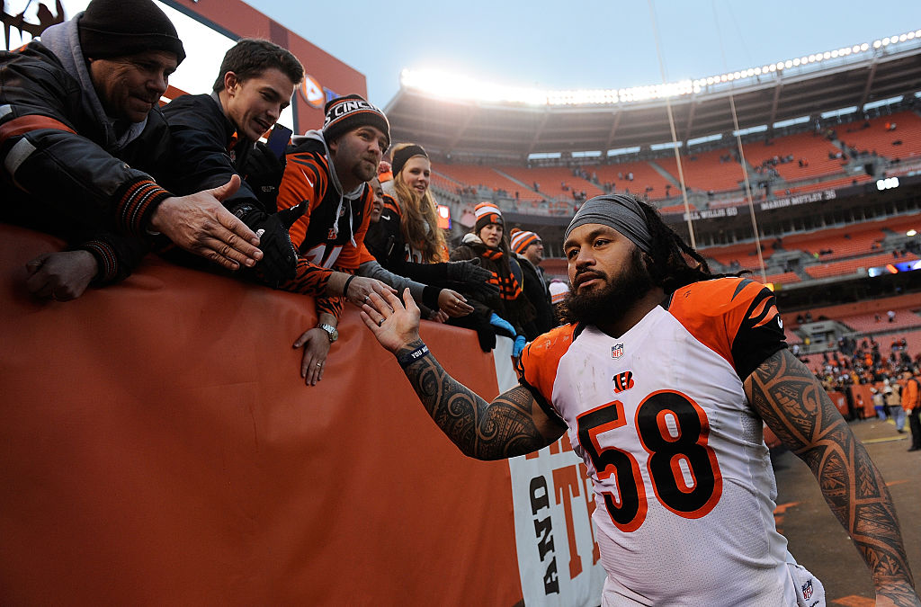 CLEVELAND, OH - DECEMBER 14: Rey Maualuga #58 of the Cincinnati Bengals celebrates with fans after a 30-0 win over the Cleveland Browns at FirstEnergy Stadium on December 14, 2014 in Cleveland, Ohio.