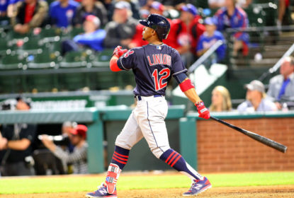 ARLINGTON, TX - APRIL 05: Francisco Lindor #12 of the Cleveland Indians hits a grand slam in the ninth inning against the Texas Rangers at Globe Life Park in Arlington on April 5, 2017 in Arlington, Texas