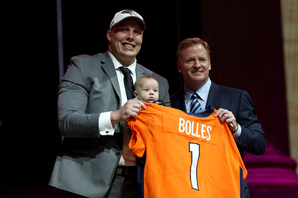 PHILADELPHIA, PA - APRIL 27: (L-R) Garett Bolles of Utah and his son Kingston pose with Commissioner of the National Football League Roger Goodell after being picked #20 overall by the Denver Broncosduring the first round of the 2017 NFL Draft at the Philadelphia Museum of Art on April 27, 2017 in Philadelphia, Pennsylvania.