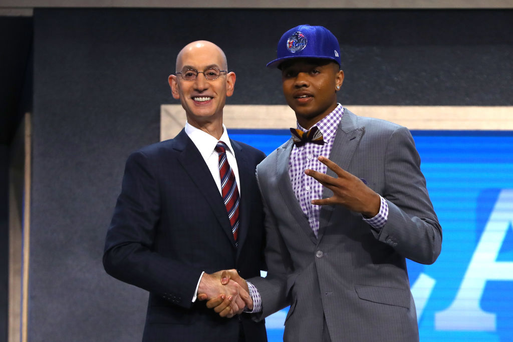 NEW YORK, NY - JUNE 22: Markelle Fultz walks on stage with NBA commissioner Adam Silver after being drafted first overall by the Philadelphia 76ers during the first round of the 2017 NBA Draft at Barclays Center on June 22, 2017 in New York City.