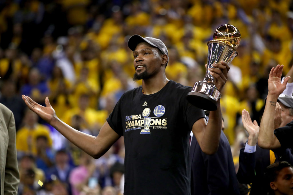 OAKLAND, CA - JUNE 12: Kevin Durant #35 of the Golden State Warriors celebrates after being named Bill Russell NBA Finals Most Valuable Player after defeating the Cleveland Cavaliers 129-120 in Game 5 to win the 2017 NBA Finals at ORACLE Arena on June 12, 2017 in Oakland, California.