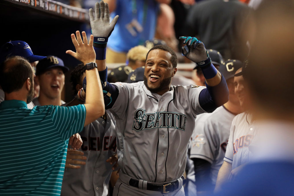 MIAMI, FL - JULY 11: Robinson Cano #22 of the Seattle Mariners and the American League celebrates with teammates after hitting a home run in the tenth inning against the National League during the 88th MLB All-Star Game at Marlins Park on July 11, 2017 in Miami, Florida.
