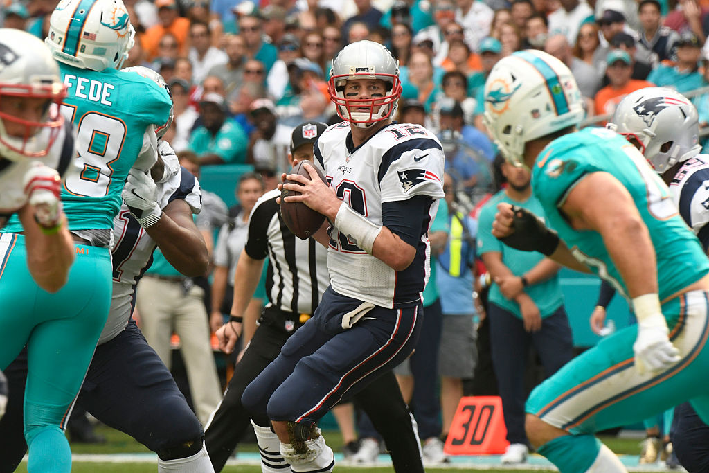 MIAMI GARDENS, FL - JANUARY 01: Tom Brady #12 of the New England Patriots looks downfield during the 1st quarter against the Miami Dolphins at Hard Rock Stadium on January 1, 2017 in Miami Gardens, Florida.
