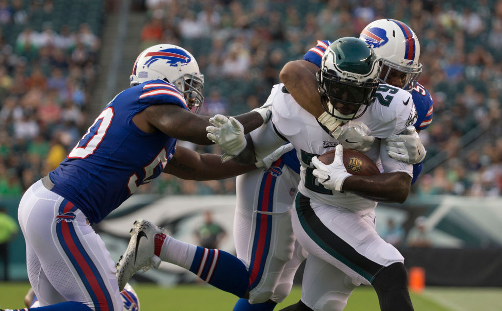 PHILADELPHIA, PA - AUGUST 17: LeGarrette Blount #29 of the Philadelphia Eagles runs the ball and is tackled by Ramon Humber #50 and Preston Brown #52 of the Buffalo Bills in the first quarter of the preseason game at Lincoln Financial Field on August 17, 2017 in Philadelphia, Pennsylvania.