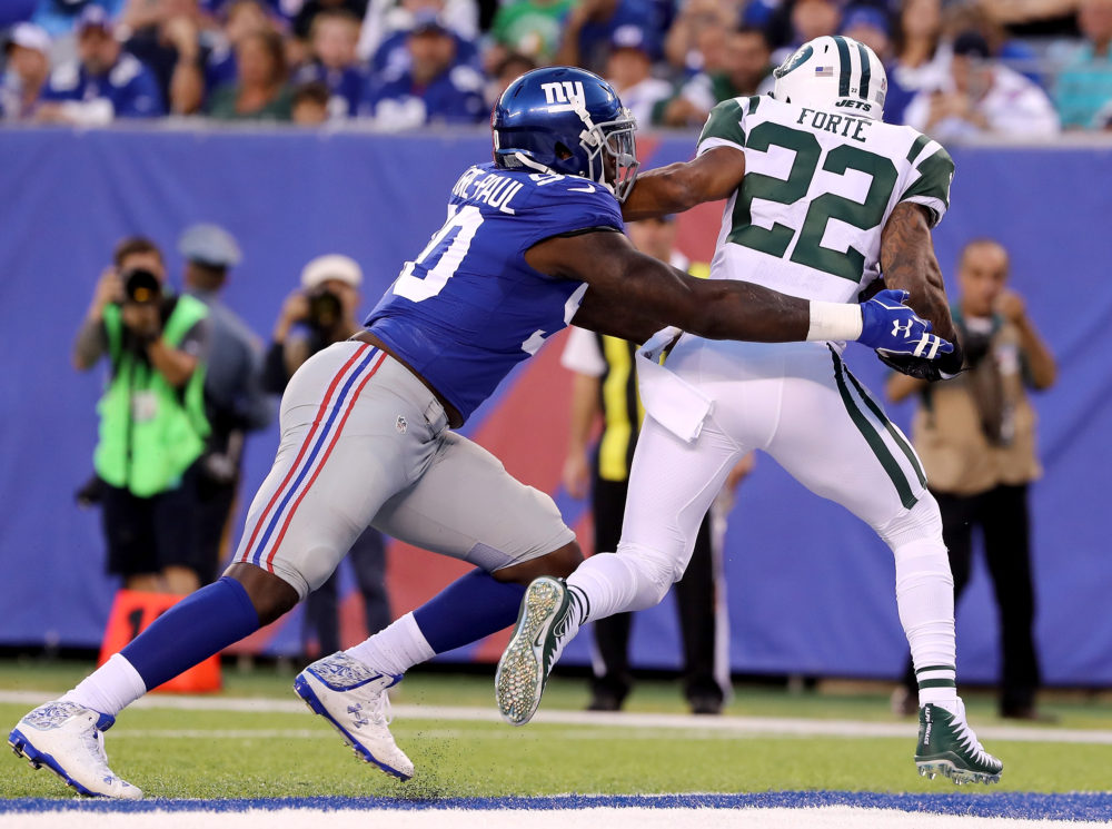 EAST RUTHERFORD, NJ - AUGUST 26: Jason Pierre-Paul #90 of the New York Giants tackles Matt Forte #22 of the New York Jets for a safety in the first quarter during a preseason game on August 26, 2017 at MetLife Stadium in East Rutherford, New Jersey