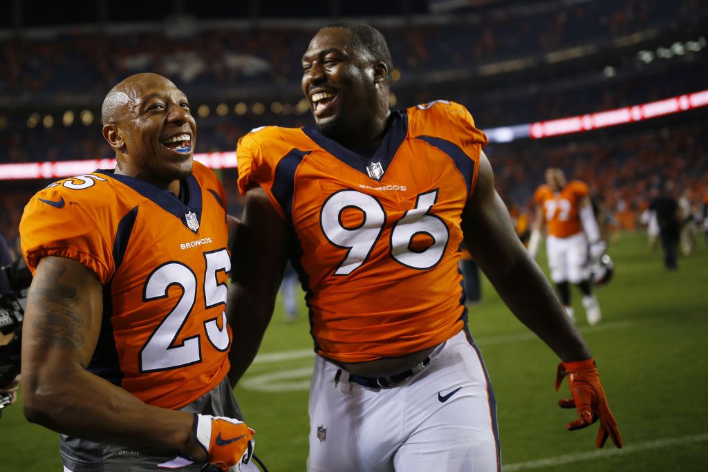 DENVER, CO - SEPTEMBER 11: Defensive end Shelby Harris #96 of the Denver Broncos celebrates winning the game with Chris Harris #25 against the Los Angeles Chargers at Sports Authority Field at Mile High on September 11, 2017 in Denver, Colorado. Harris blocked the game-tying field goal in the fourth quarter.