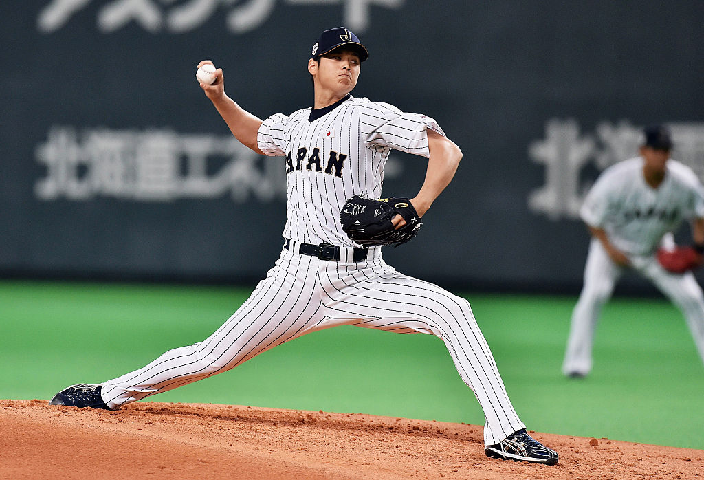 SAPPORO, JAPAN - NOVEMBER 08: Starting pitcher Shohei Otani #16 throws in the top of second inning during the WBSC Premier 12 match between Japan and South Korea at the Sapporo Dome on November 8, 2015 in Sapporo, Hokkaido, Japan.