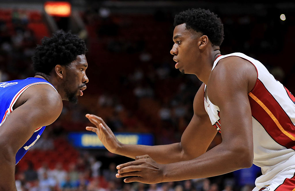 MIAMI, FL - OCTOBER 21: Joel Embiid #21 of the Philadelphia 76ers drives on Hassan Whiteside #21 of the Miami Heat during a preseason game at American Airlines Arena on October 21, 2016 in Miami, Florida.