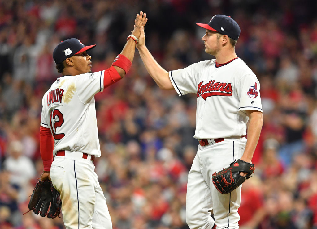 CLEVELAND, OH - OCTOBER 05: Francisco Lindor #12 congratulates Trevor Bauer #47 of the Cleveland Indians as he is taken out of the game during the seventh inning against the New York Yankees during game one of the American League Division Series at Progressive Field on October 5, 2017 in Cleveland, Ohio.