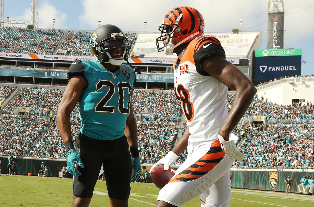 JACKSONVILLE, FL - NOVEMBER 05: A.J. Green #18 of the Cincinnati Bengals and Jalen Ramsey #20 of the Jacksonville Jaguars discuss a play in the first half of their game at EverBank Field on November 5, 2017 in Jacksonville, Florida.