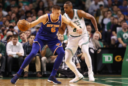Al Horford #42 of the Boston Celtics defends Kristaps Porzingis #6 of the New York Knicks during the first half at TD Garden on October 24, 2017 in Boston, Massachusetts.