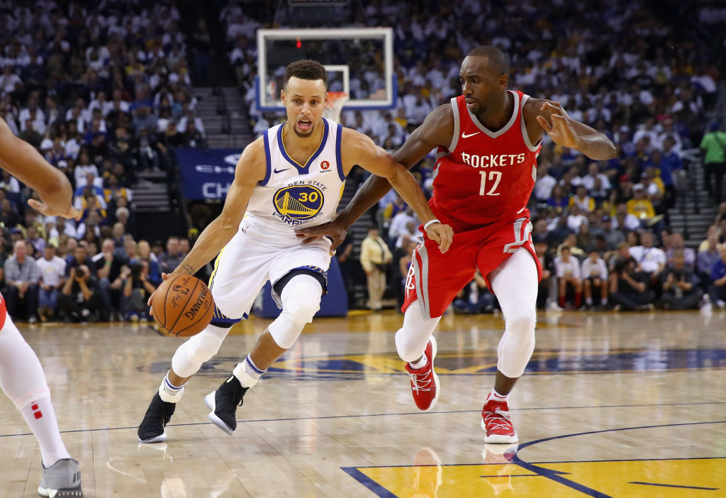 OAKLAND, CA - OCTOBER 17: Stephen Curry #30 of the Golden State Warriors drives on Luc Mbah a Moute #12 of the Houston Rockets at ORACLE Arena on October 17, 2017 in Oakland, California