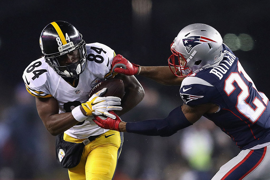 FOXBORO, MA - JANUARY 22: Antonio Brown #84 of the Pittsburgh Steelers runs with the ball against Malcolm Butler #21 of the New England Patriots in the AFC Championship Game at Gillette Stadium on January 22, 2017 in Foxboro, Massachusetts.