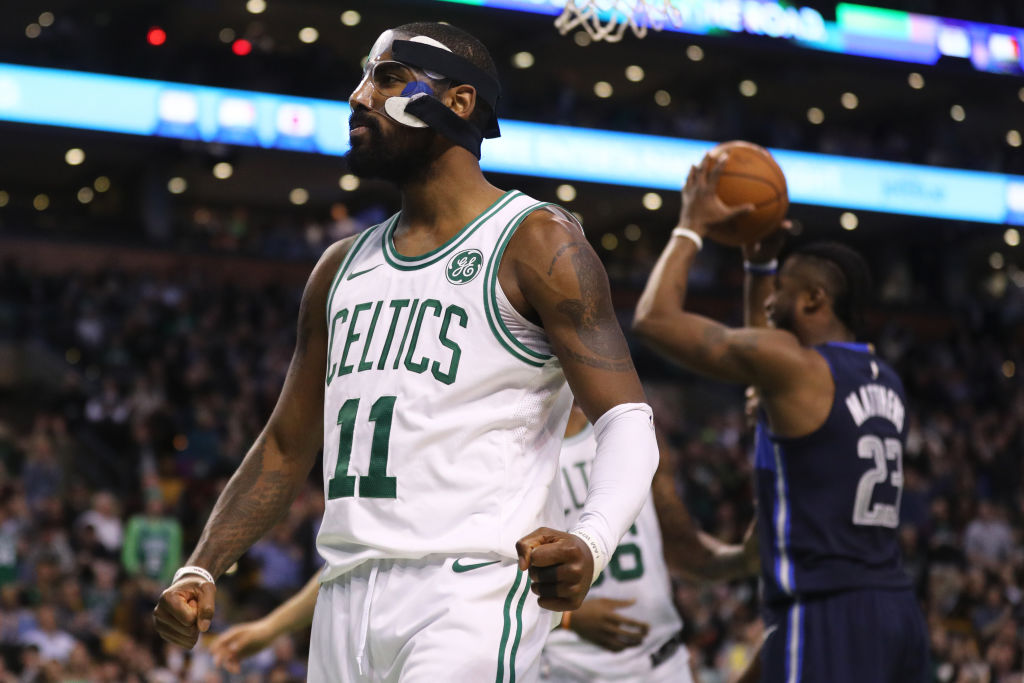BOSTON, MA - DECEMBER 6: Kyrie Irving #11 of the Boston Celtics celebrates during the second half against the Dallas Mavericks at TD Garden on December 6, 2017 in Boston, Massachusetts. The Celtics defeat the Mavericks 97-90.